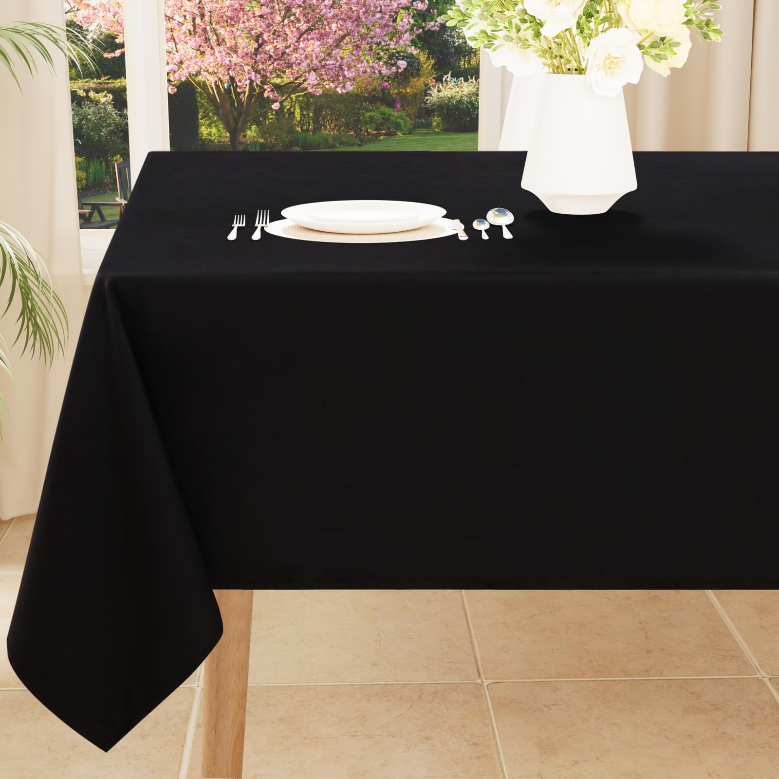 Smiry rectangle table cloth in black with waterproof coating beads spills for easy cleanup.