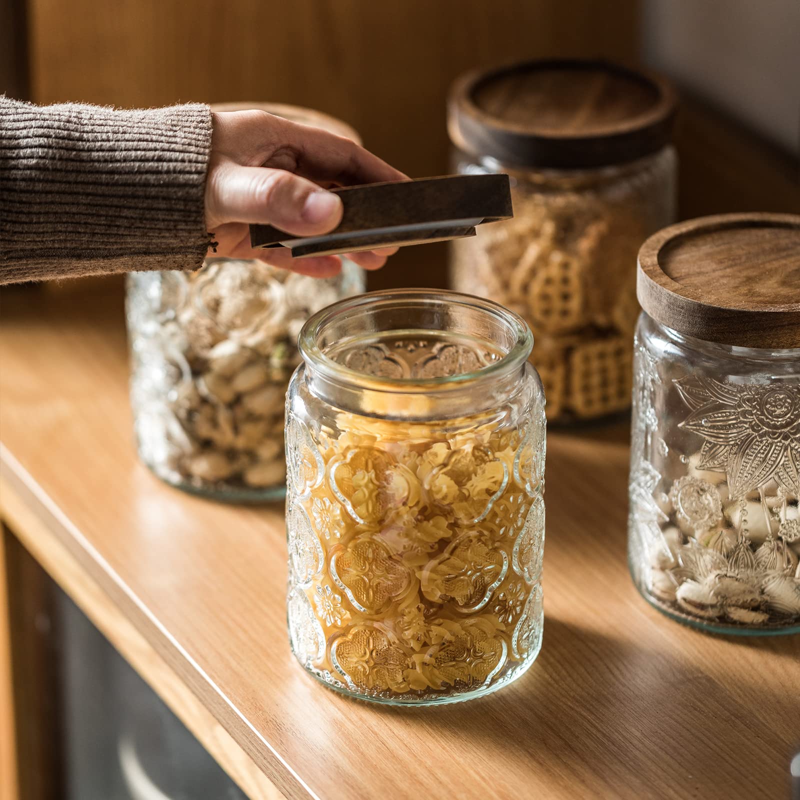 Snminetal plum-pattern jar doubles as a decorative kitchen storage piece.
