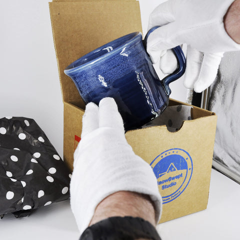 SnowSwept Studio mug packaging box, ready for gifting.