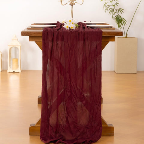 Socomi burgundy-red table runner creates soft texture for holiday celebrations.