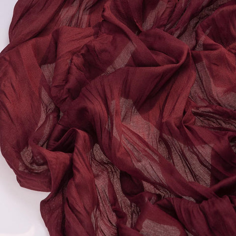Socomi cheesecloth runner enhances rustic decor at a birthday party or baby shower.