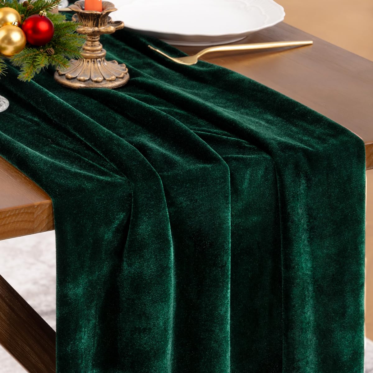 Socomi green velvet table runner with emerald sheen enhances festive dining spaces.