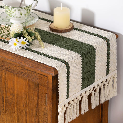 Socomi olive green table runner with macrame fringe enhances the dining room focal point.