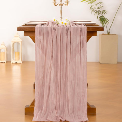 Socomi pink cheesecloth table runner at a baby shower adding delicate texture
