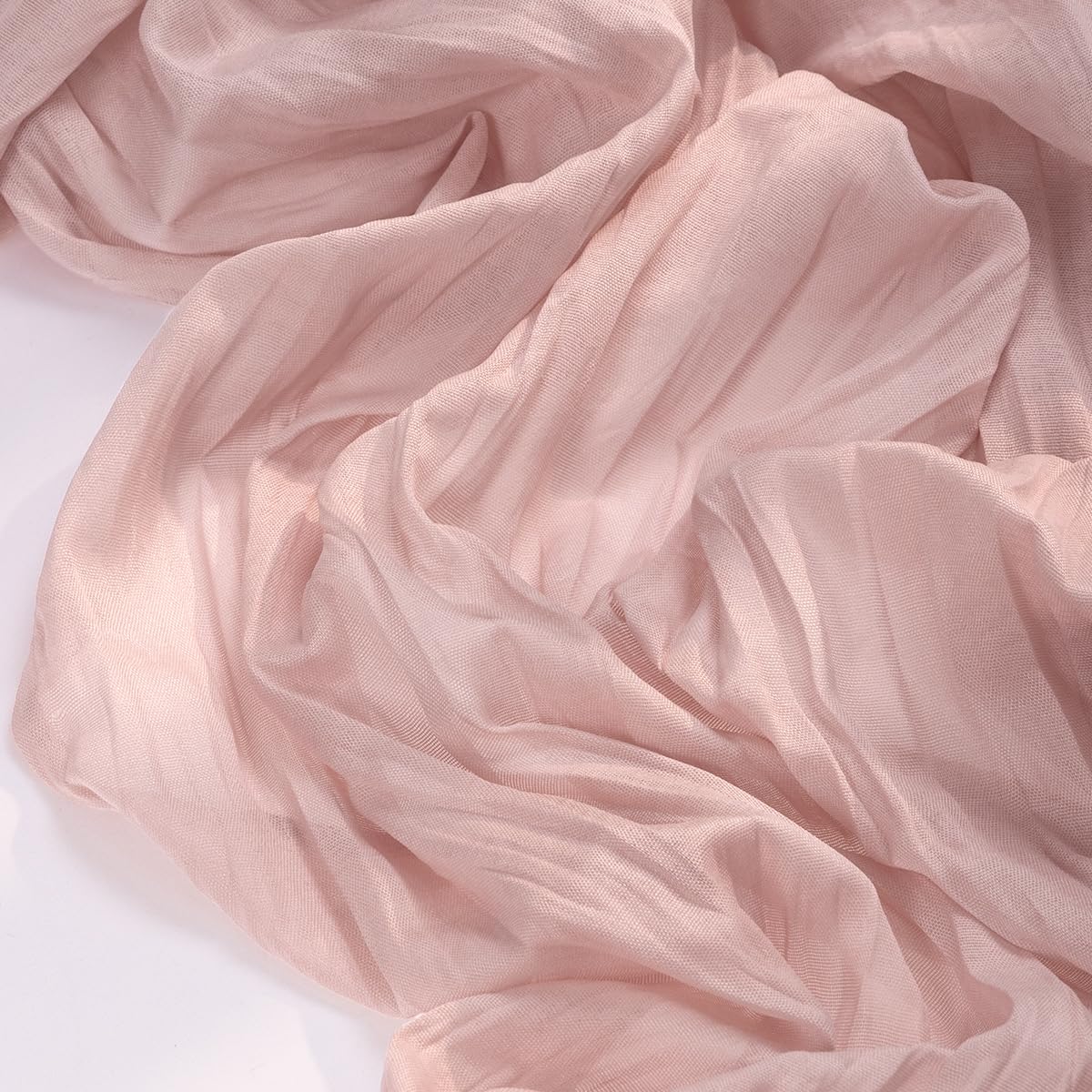 Socomi pink cheesecloth table runner laid across a dining table for a romantic setup