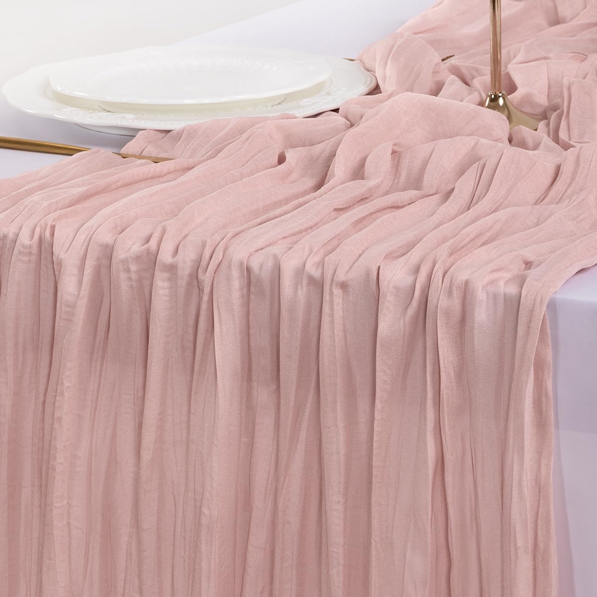 Socomi pink cheesecloth table runner creating a cozy photoshoot backdrop