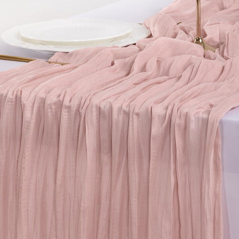 Socomi pink cheesecloth table runner creating a cozy photoshoot backdrop