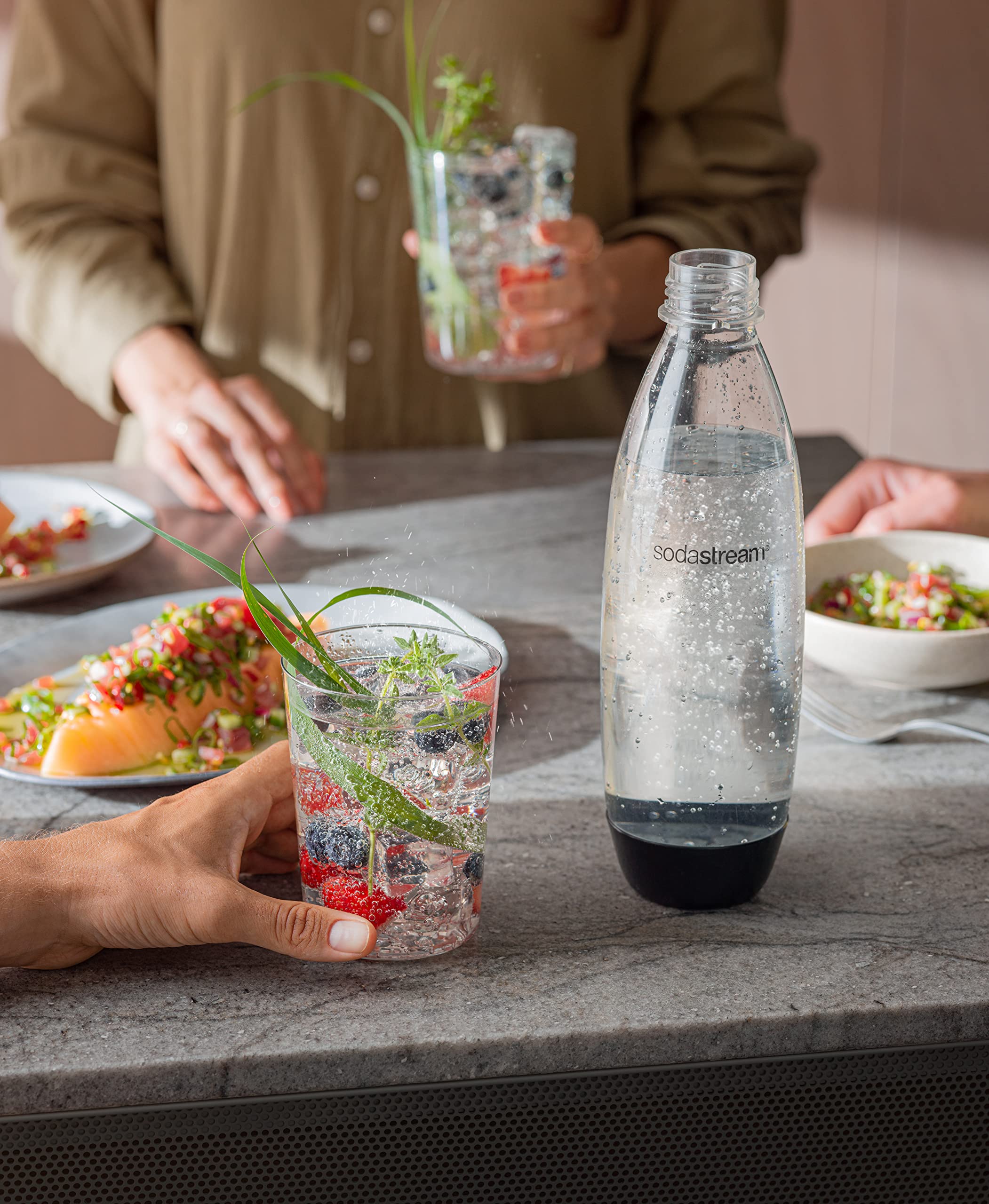 Sodastream bottle fits car cup holder for beverages on the go.