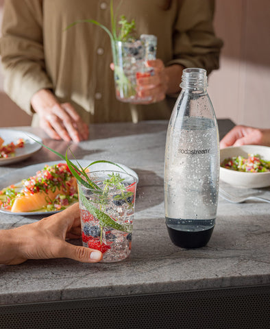Sodastream bottle fits car cup holder for beverages on the go.