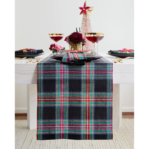 Solino Home Jewel Plaid table runner in black elevating an elegant dining setup