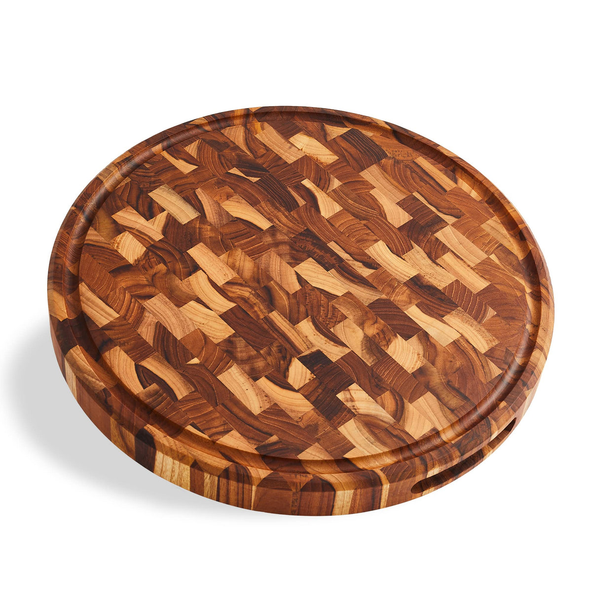 Sonder Los Angeles Vincent round cutting board on a kitchen counter with a juice groove for mess-free prep.