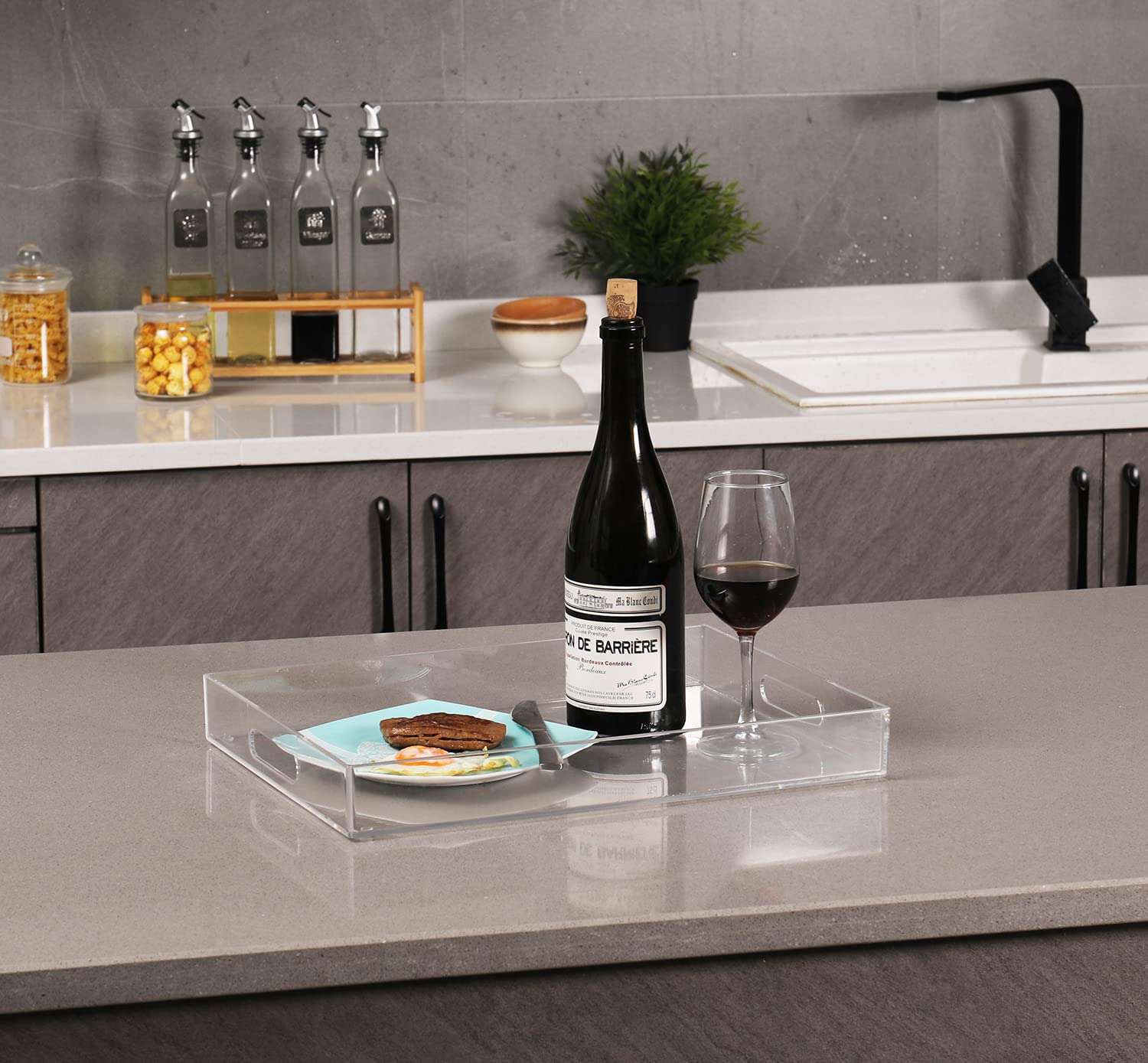 Sooyee clear acrylic tray with handles for easy transport of drinks and snacks.