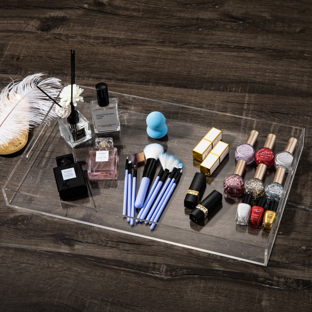 Sooyee clear vanity tray neatly holds cosmetics and small items.