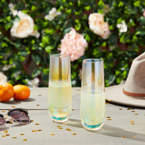 Sparkle and Bash iridescent stemless champagne flute set of 4 on table.