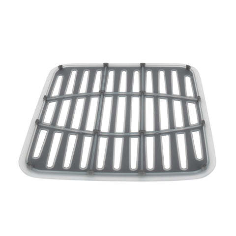 Spectrum Cora mat drains water back into the sink for faster drying.