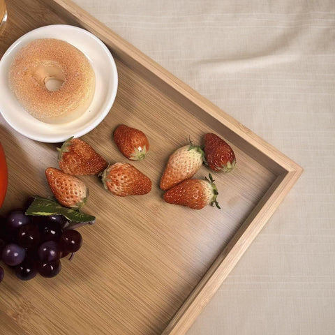 Sprieny tray with handles simplifies carrying from kitchen to table.