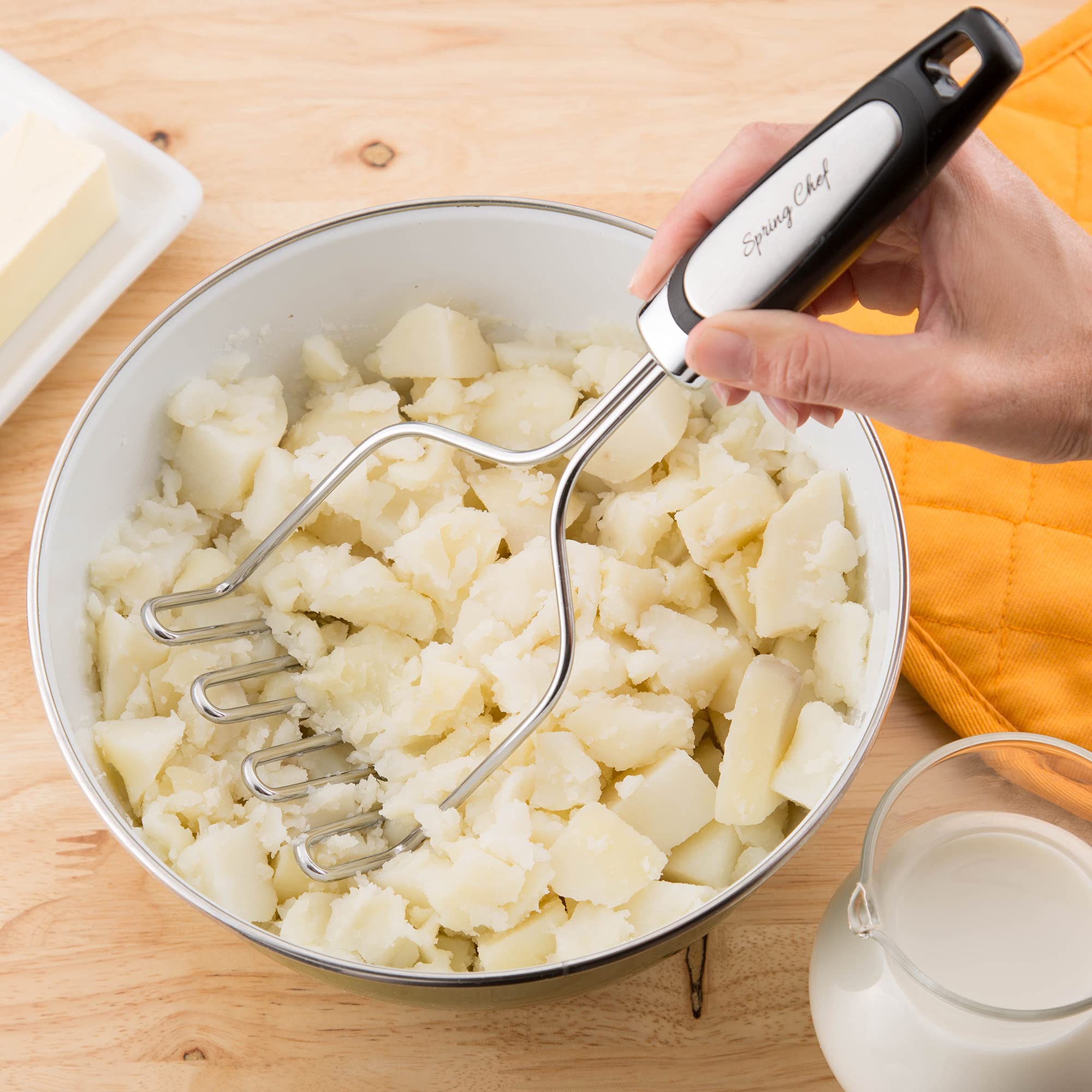 Spring Chef masher in action mashes potatoes and soft foods with ease.
