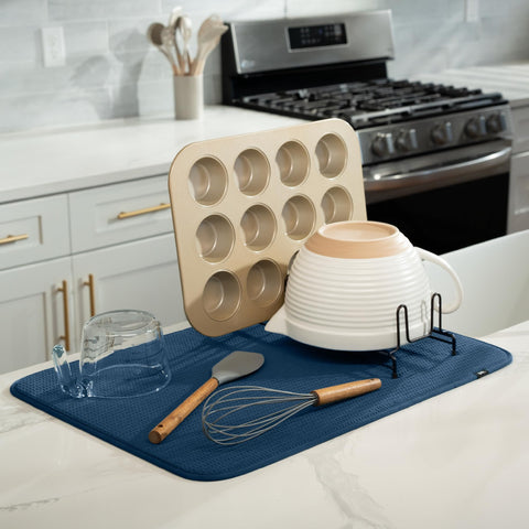 S&T INC. Microfiber drying pad absorbing spills beside a drying rack