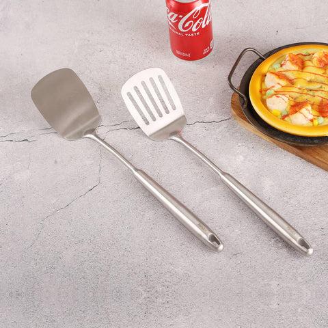 Standcn dishwasher-safe stainless spatula for easy cleanup after meals.