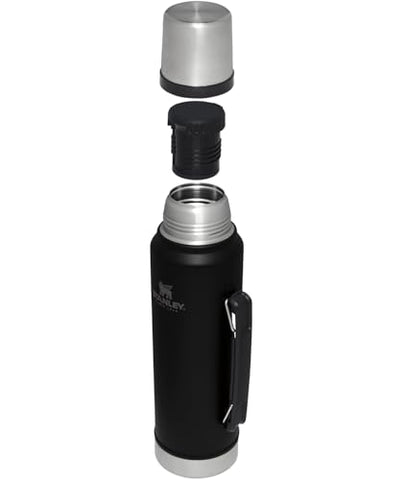 Stanley Classic vacuum bottle leak-proof cup lid prevents spills in a backpack.
