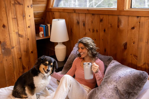 STANLEY mug demonstrates double-wall vacuum insulation for temp retention.