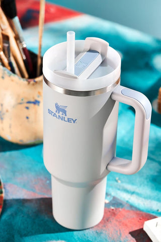 STANLEY Quencher H2.0 40 oz fits most car cup holders for travel convenience.