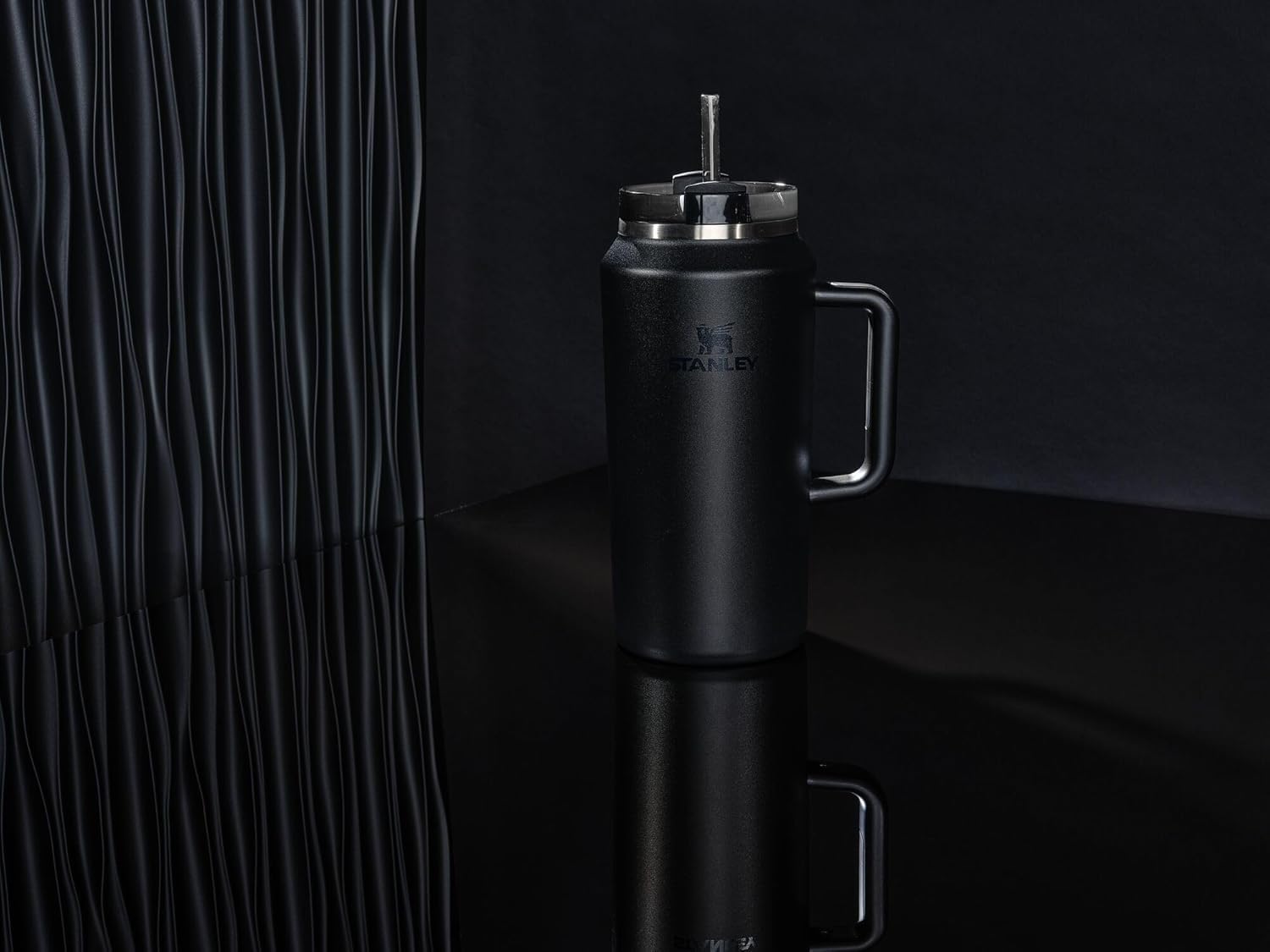 STANLEY Quencher H2.0 64oz capacity minimizes refills during day trips.