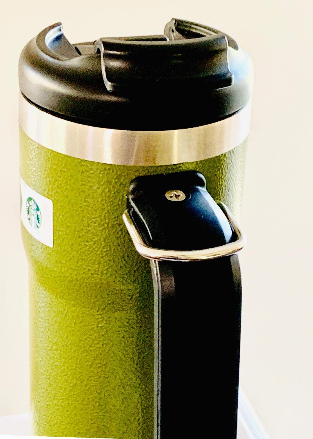 Starbucks x Stanley tumbler handle with D-ring clip for easy bag attachment.