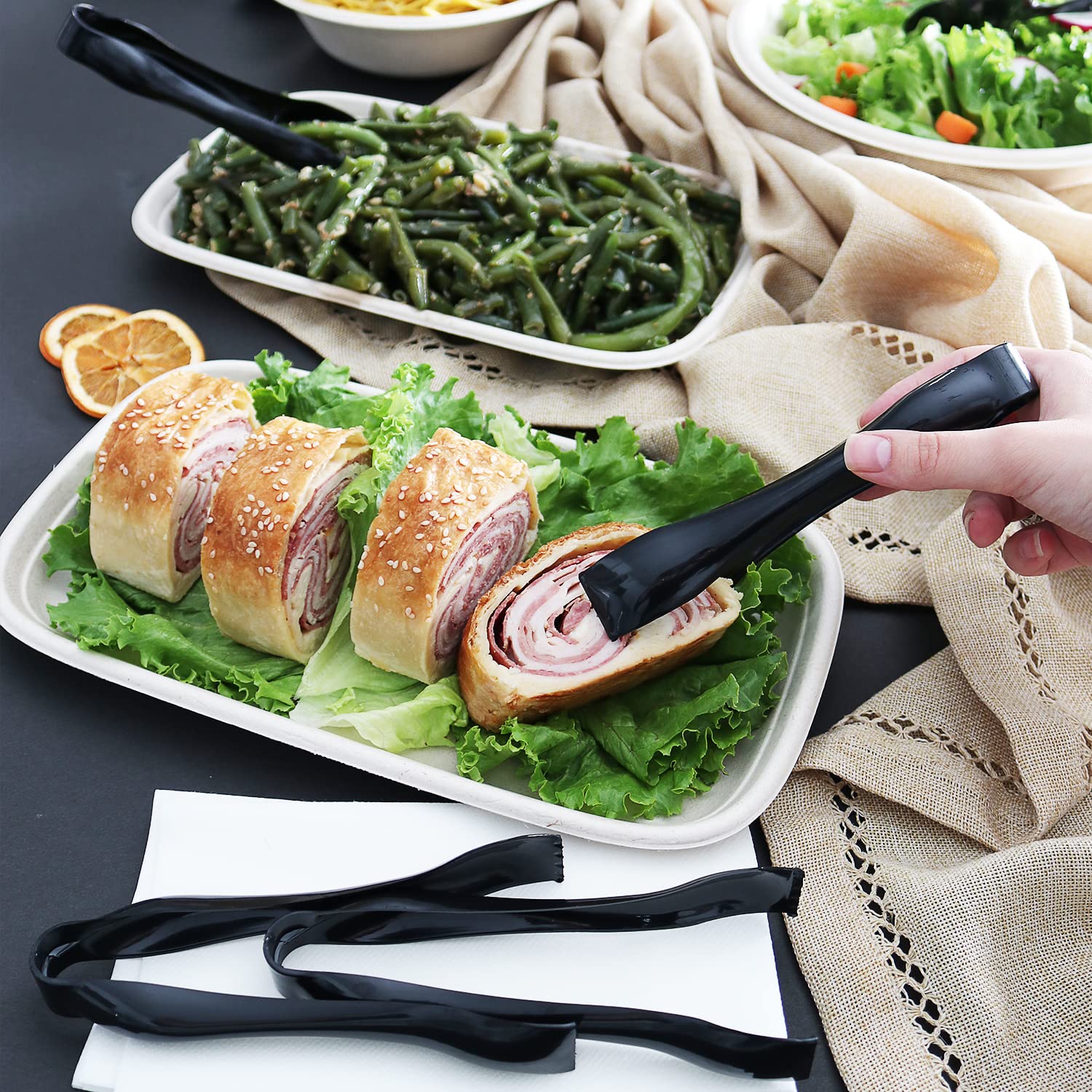 StarMar 6-1/2-inch black tongs shown for buffet-like serving.