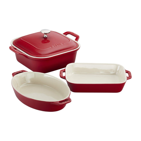 Staub ceramic 4-piece baking pans set in cherry red ready for oven-to-table use.