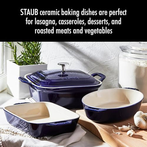 Staub 9-inch oval ceramic baking dish with elegant glaze for oven-to-table servings.