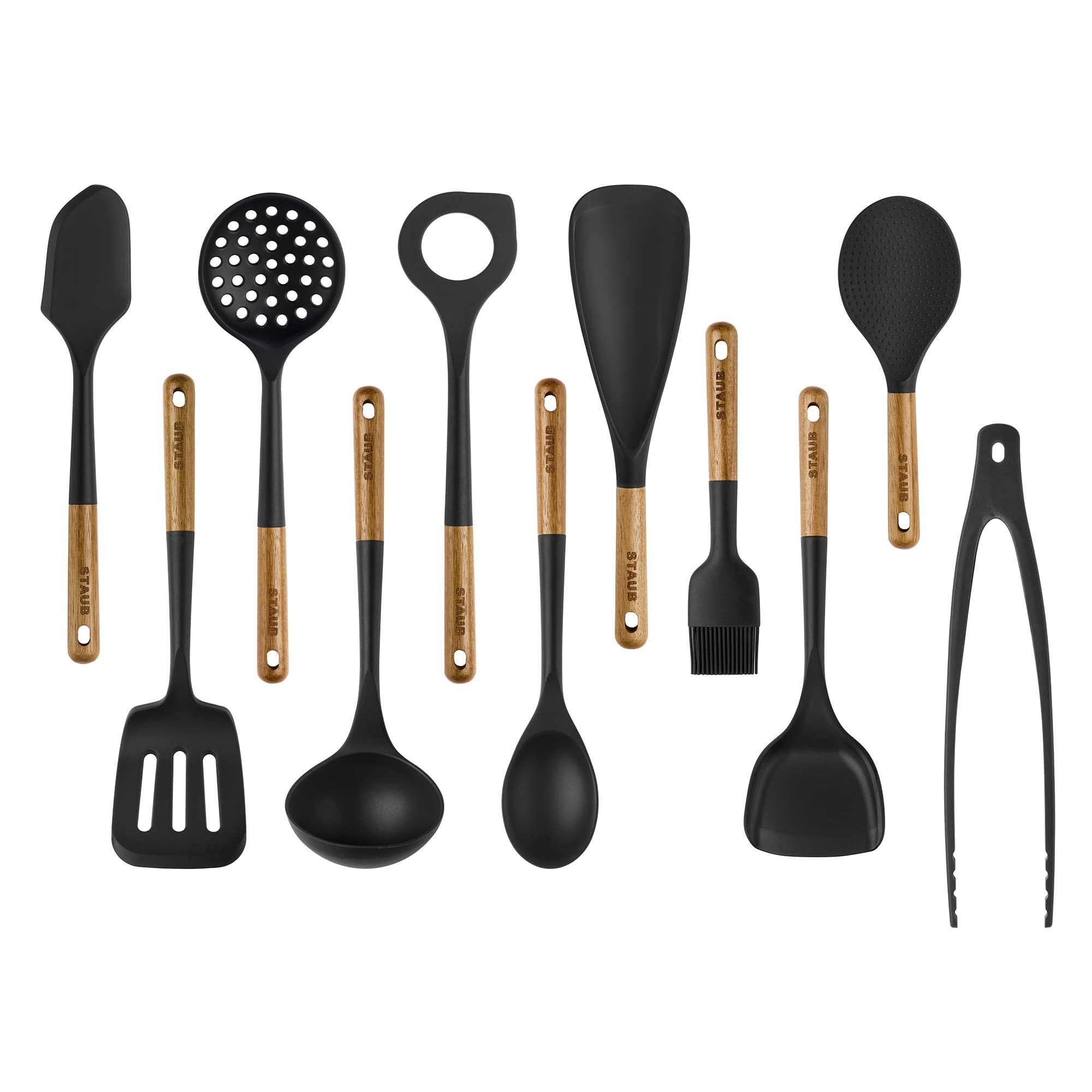 STAUB 11-piece silicone set with wood handles, spatula used for versatile cooking on nonstick pans.