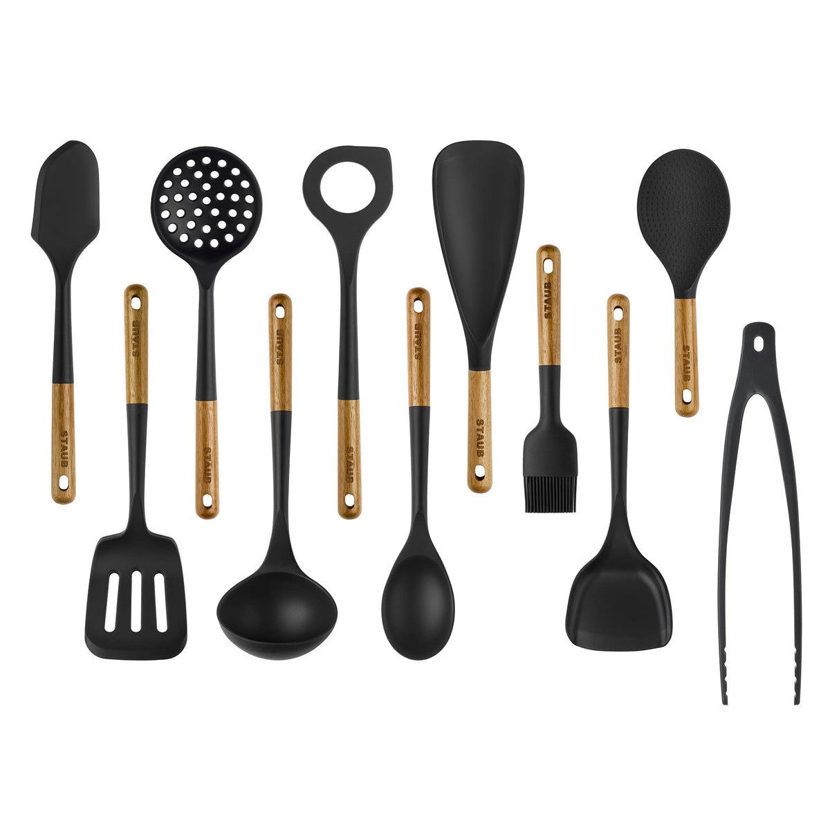 STAUB 11-piece silicone set with wood handles, spatula used for versatile cooking on nonstick pans.