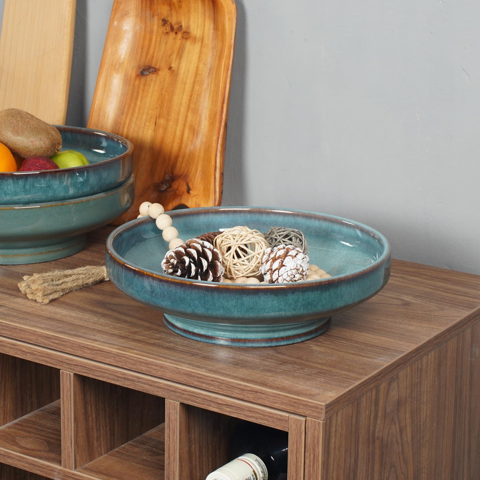 STE-CER blue fruit bowl on the counter showcasing snacks and fruit.