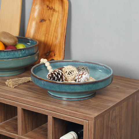 STE-CER blue fruit bowl on the counter showcasing snacks and fruit.