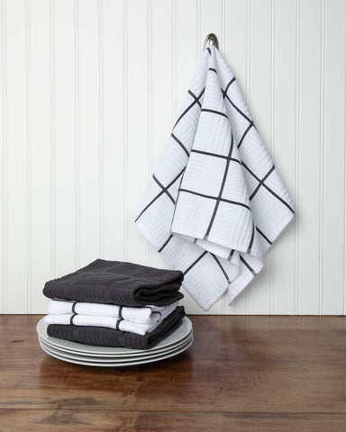 Sticky Toffee windowpane towels in gray and white add style while drying dishes.