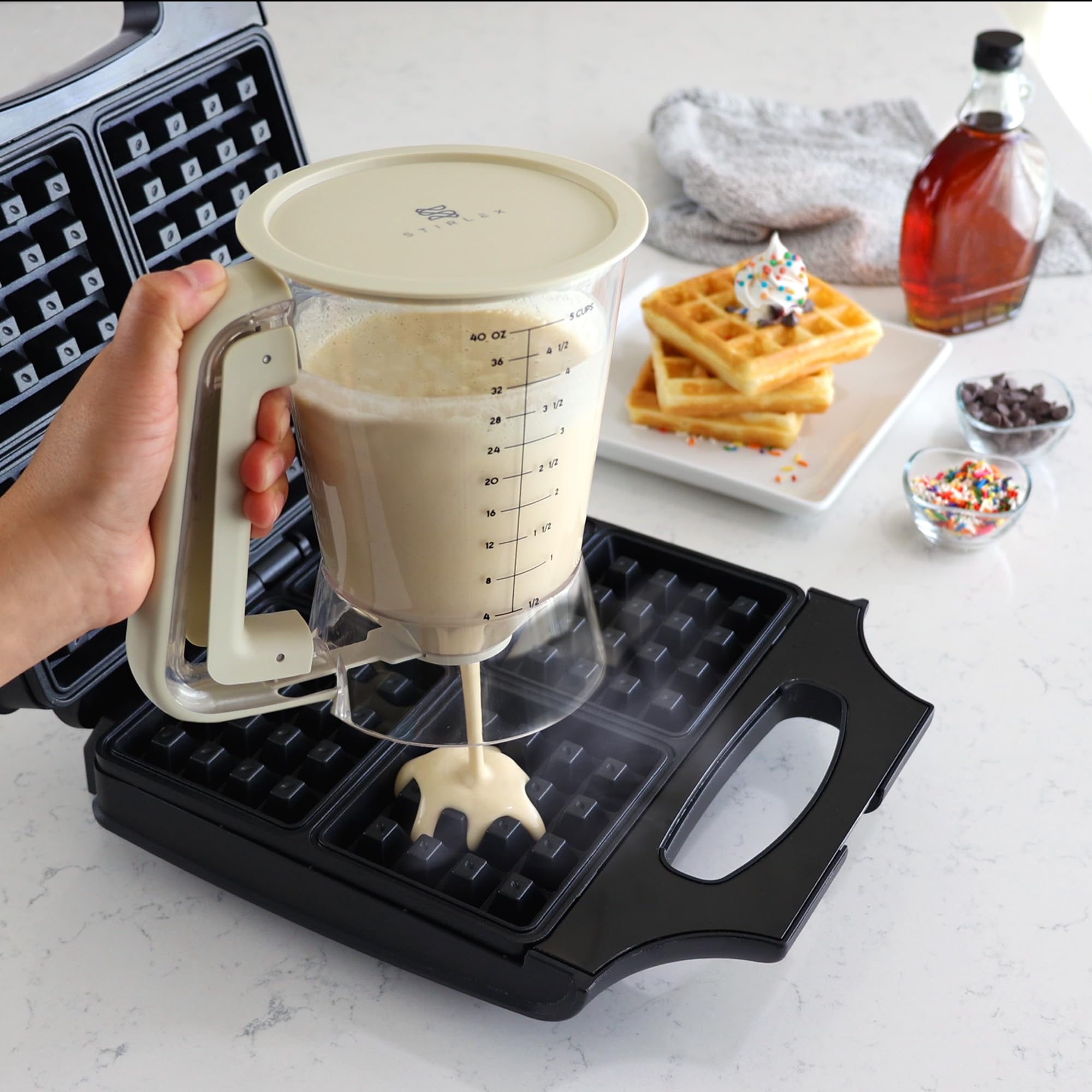 STIRLEX cap doubles as a drip tray catching excess batter.