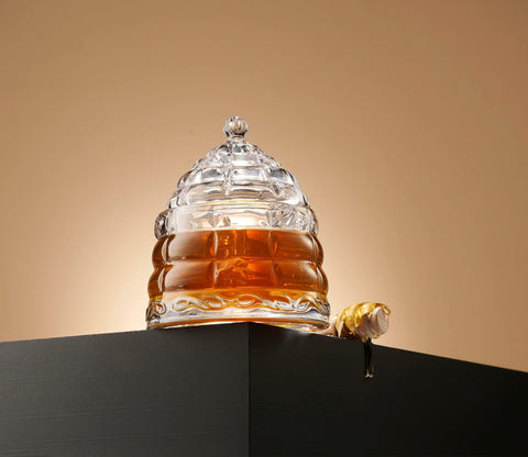 Studio Silversmiths beehive design honey dish adds elegance to the table.