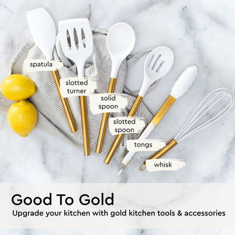 STYLED SETTINGS White and gold design on display — stylish kitchen decor accent.