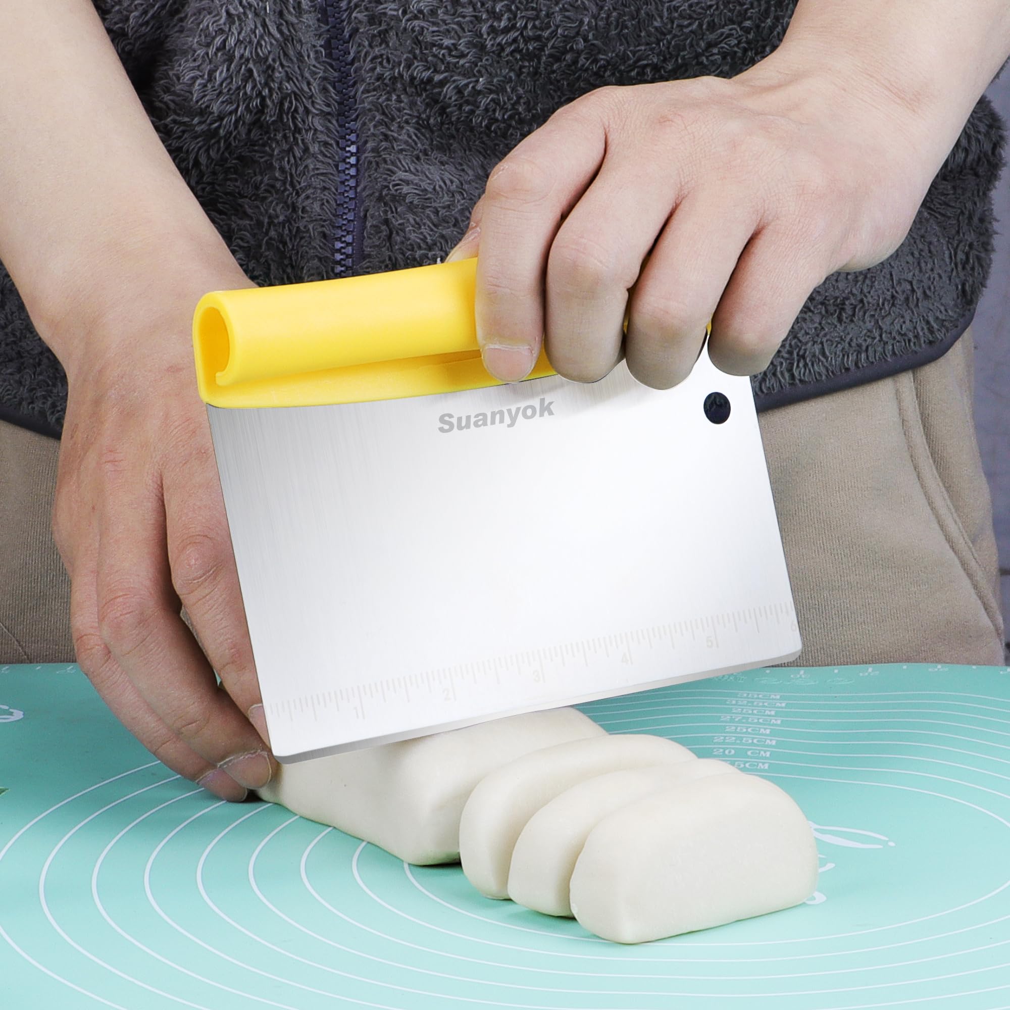 Suanyok dough scraper with flexible handle for easy bowl cleanup.