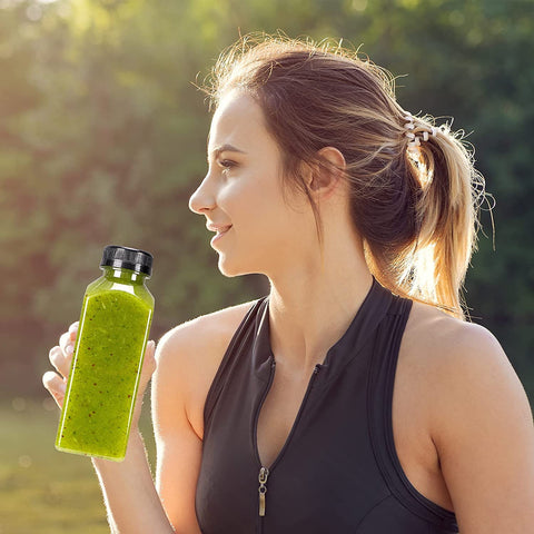 SUPERLELE empty bottle held shows versatile use for smoothies, tea, or juice.