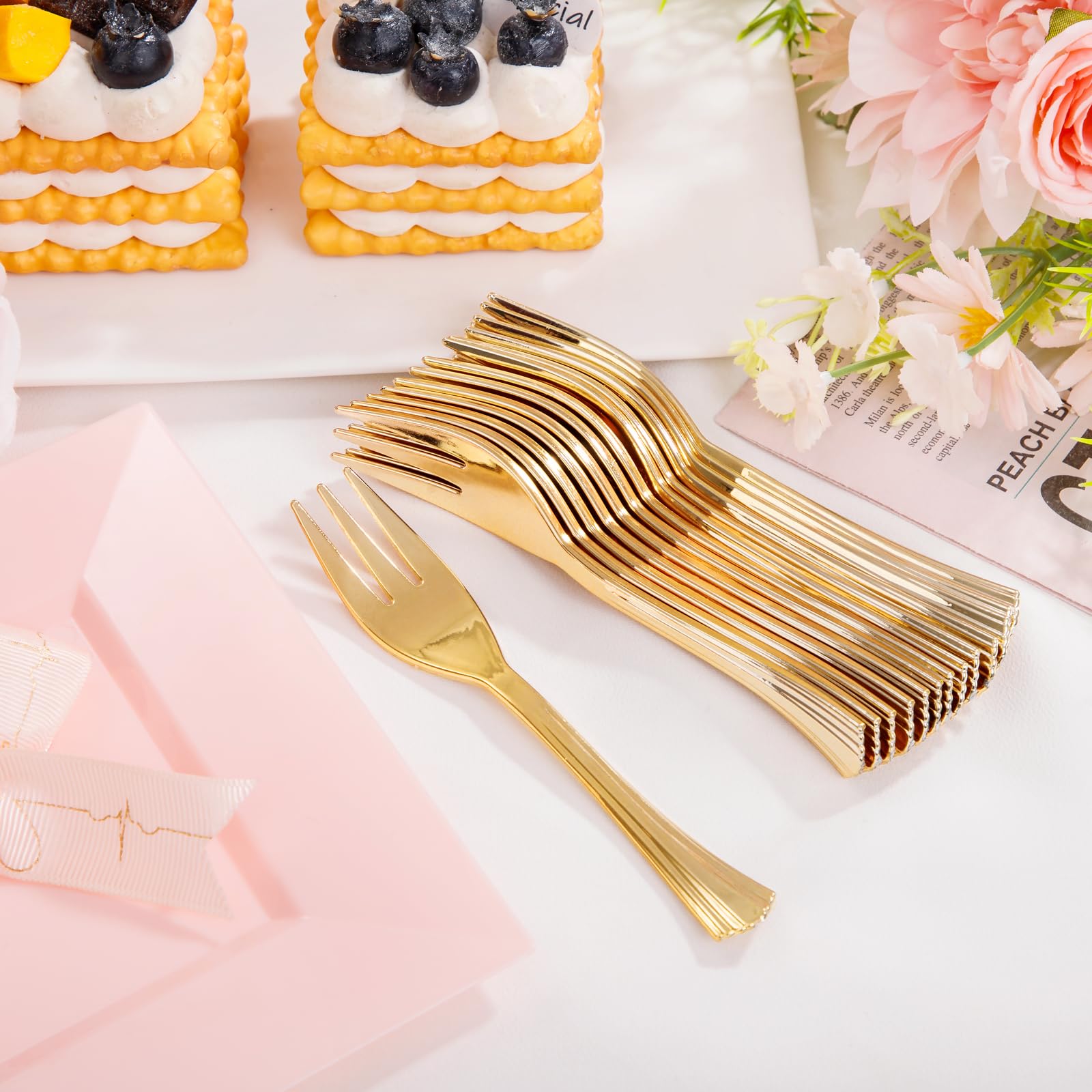 Supernal gold forks on plate set for celebration