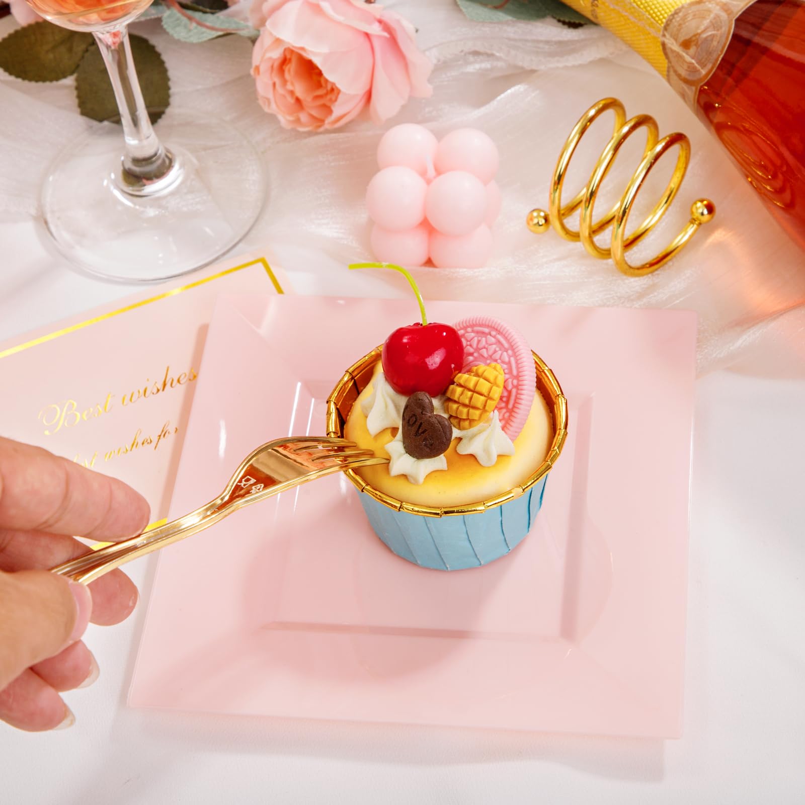 Supernal pink plates with gold forks wedding table setup