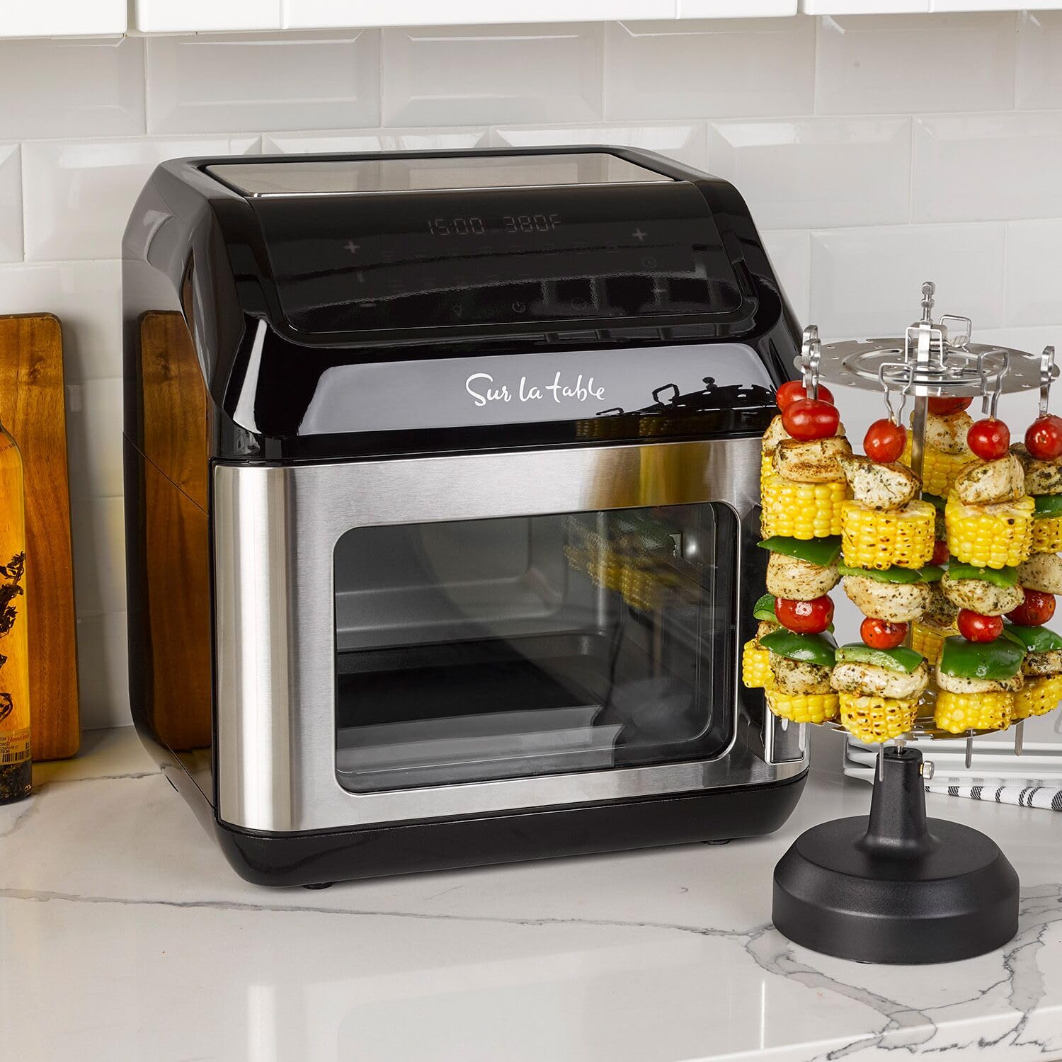 Sur La Table left hinge air fryer with door open shows roomy 13-quart capacity