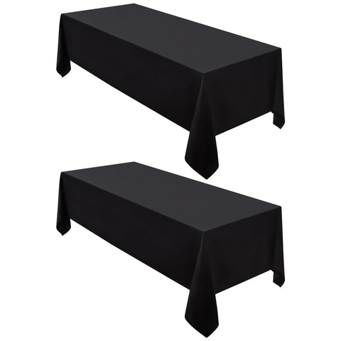Surmente black 60x102 tablecloth draped on dining table for a refined look.
