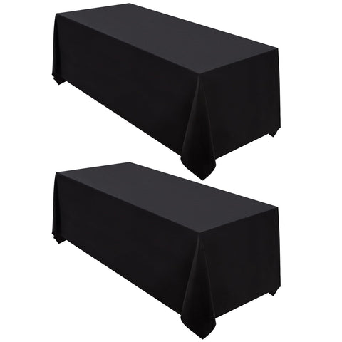 Surmente black 90x132 rectangular tablecloth drapes evenly for full coverage and stain resistance.