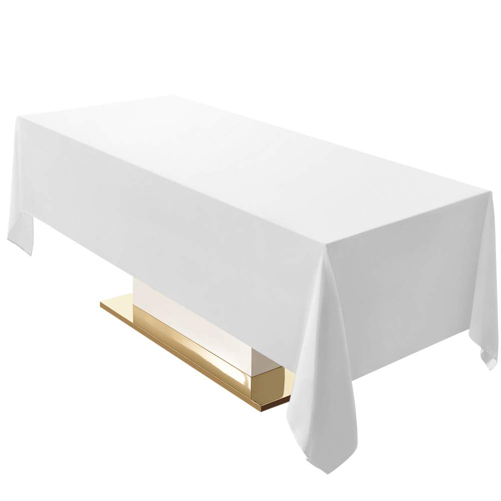 Surmente white rectangle tablecloth 60x120 draped on a dining table, enhancing ambiance.