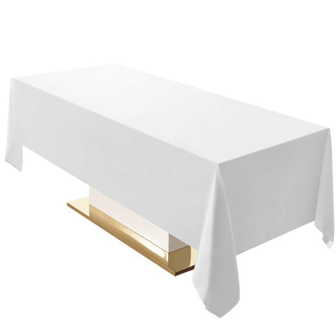 Surmente white rectangle tablecloth 60x120 draped on a dining table, enhancing ambiance.
