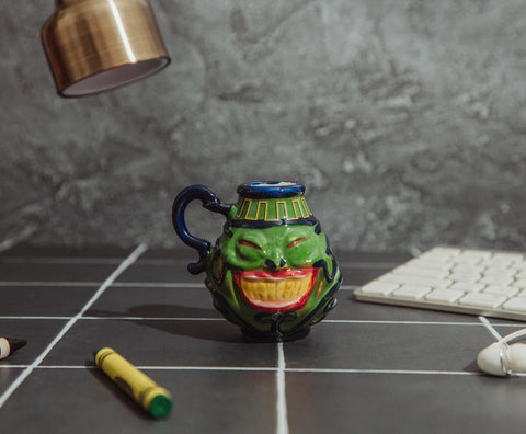 Surreal Entertainment Pot Of Greed mini mug back view, great for display and gifting.