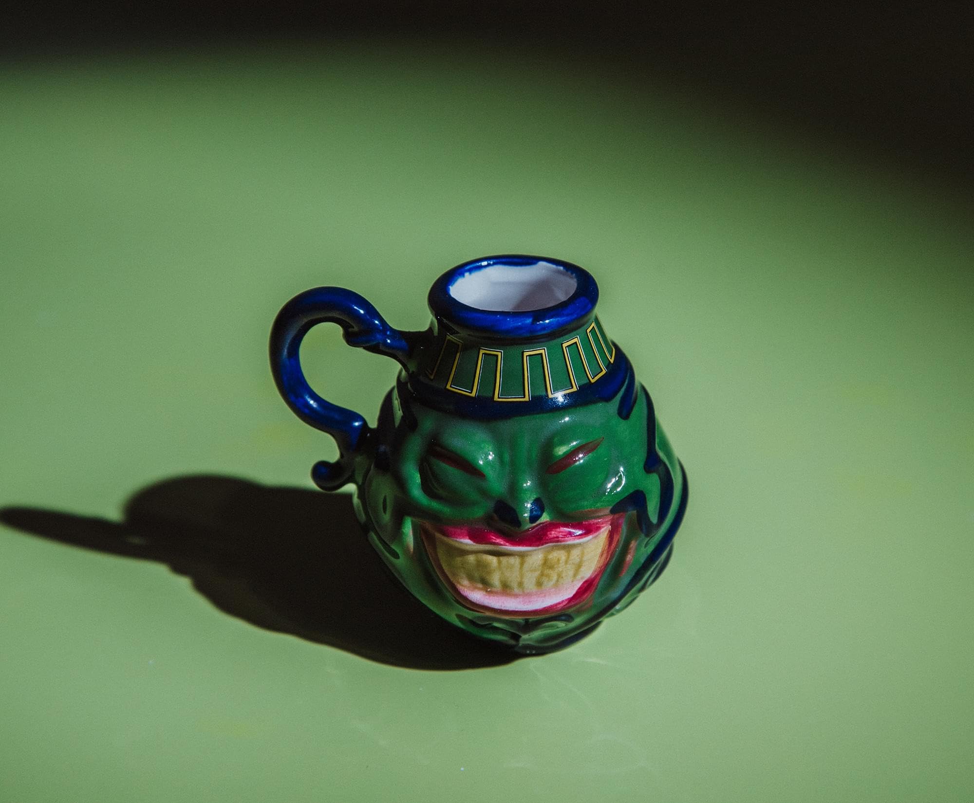 Surreal Entertainment Pot Of Greed mini mug in use with espresso, perfect for quick caffeine boosts.